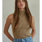 A person wearing a tan Knit Turtleneck Sleeveless Pullover Top in a sleeveless, ribbed turtleneck style.
