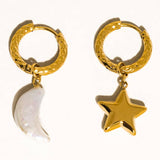Tillyn Mismatch Moon and Star Earring by Flanerie by MAIQ, featuring two 18K gold hoop earrings with a pearl moon charm and a gold star charm.