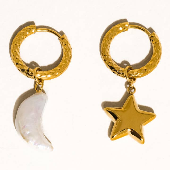 Tillyn Mismatch Moon and Star Earring by Flanerie by MAIQ, featuring two 18K gold hoop earrings with a pearl moon charm and a gold star charm.