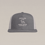 Gray and white Bird Dog Classic Shop Hat by Ballad Originals, featuring “BALLAD of the BIRD DOG BRENHAM, TX” and a bird dog graphic embroidered on the front. Designed for everyday wear, this hat showcases our dedication to quality craftsmanship.