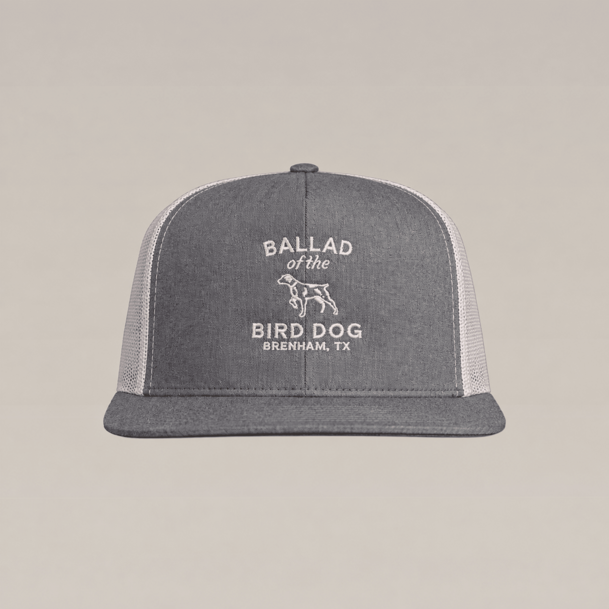 Gray and white Bird Dog Classic Shop Hat by Ballad Originals, featuring “BALLAD of the BIRD DOG BRENHAM, TX” and a bird dog graphic embroidered on the front. Designed for everyday wear, this hat showcases our dedication to quality craftsmanship.