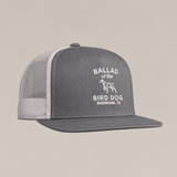 Introducing the Bird Dog Classic Shop Hat by Ballad Originals—a gray and white mesh trucker hat from our Classic Chop Logo Hat collection, featuring our signature shop logo with “Ballad of the Bird Dog, Brenham, TX” and a dog graphic printed on the front panel. A true quality goods accessory.