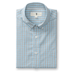 The Duck Head Cotton Cashmere Poplin Sport Shirt is a folded button-down featuring a blue and red plaid pattern, crisp collar, and signature brand label.
