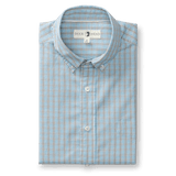 The Duck Head Cotton Cashmere Poplin Sport Shirt is a folded button-down featuring a blue and red plaid pattern, crisp collar, and signature brand label.