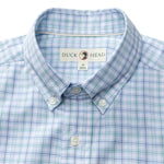 The Duck Head Cotton Twill Sport Shirt is a men's blue and green plaid button-down with white buttons, featuring the Duck Head label, neatly folded.