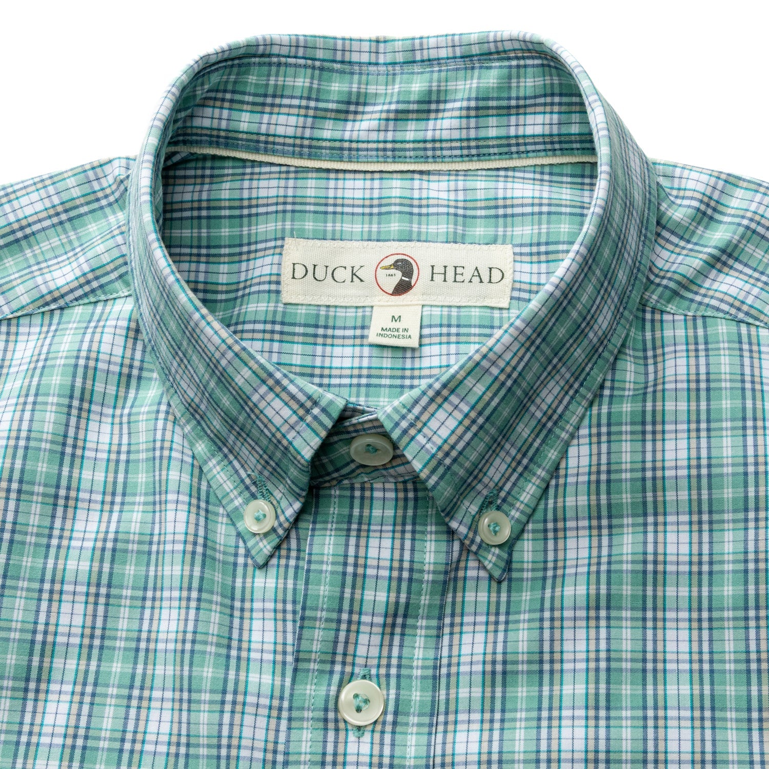 The Duck Head Performance Poplin Sport Shirt is a green and white plaid button-down with collar, collar point buttons, a "Duck Head" label, and moisture-wicking fabric for all-day comfort.