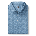 The Duck Head Long Drive Performance Polo in light blue features a subtle duck pattern, three buttons, and moisture-wicking fabric—ideal for comfort on and off the golf course.