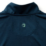 The back of the Duck Head Long Drive Performance 1/4 Zip Pullover in navy shows a small green embroidered duck logo beneath the neckline and is made from moisture-wicking fabric for comfort during any activity.