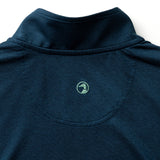 The back of the Duck Head Long Drive Performance 1/4 Zip Pullover in navy shows a small green embroidered duck logo beneath the neckline and is made from moisture-wicking fabric for comfort during any activity.