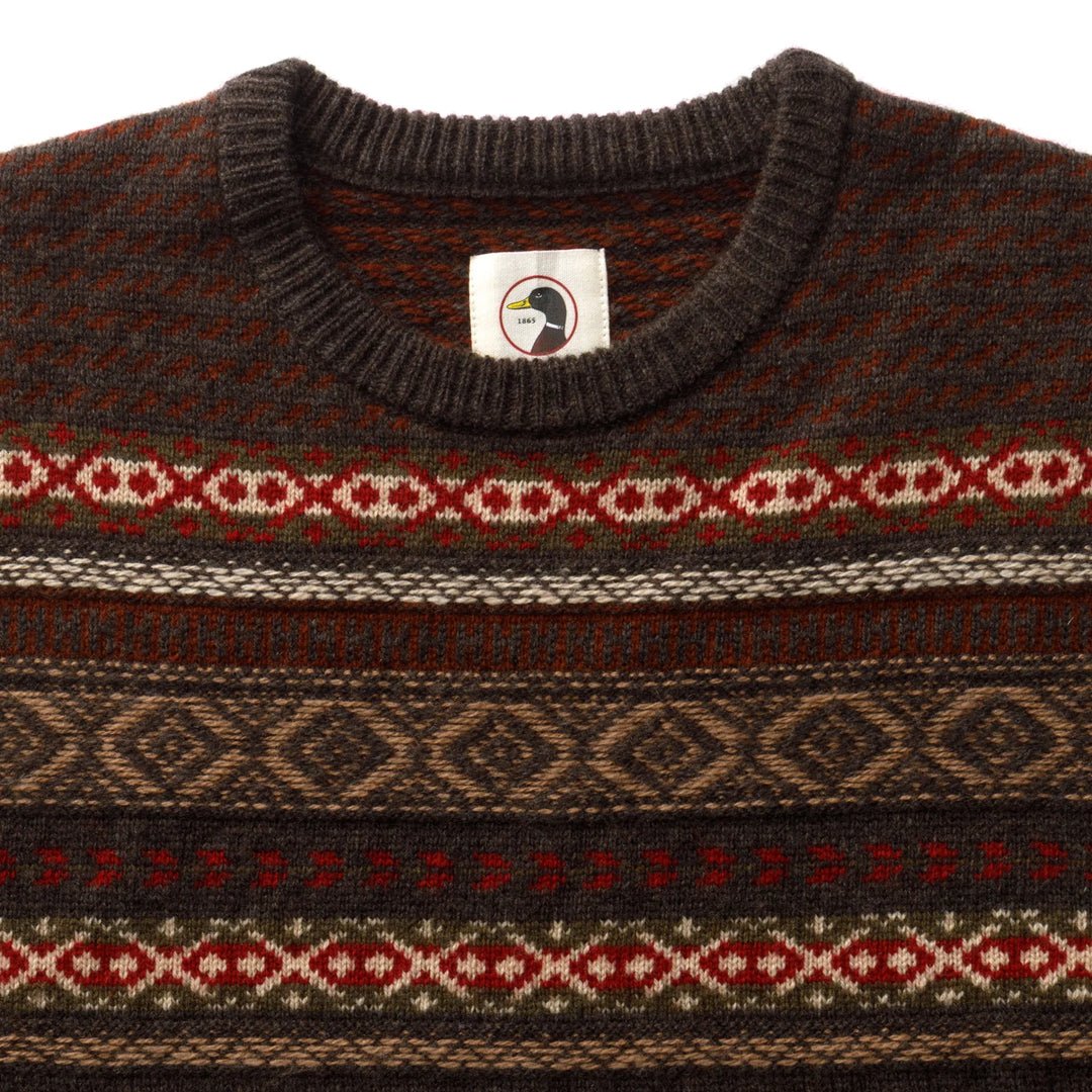 Bird Fair Isle Crewneck Sweater in dark brown 7 gauge merino wool with a multicolor geometric Fair Isle pattern across the chest.