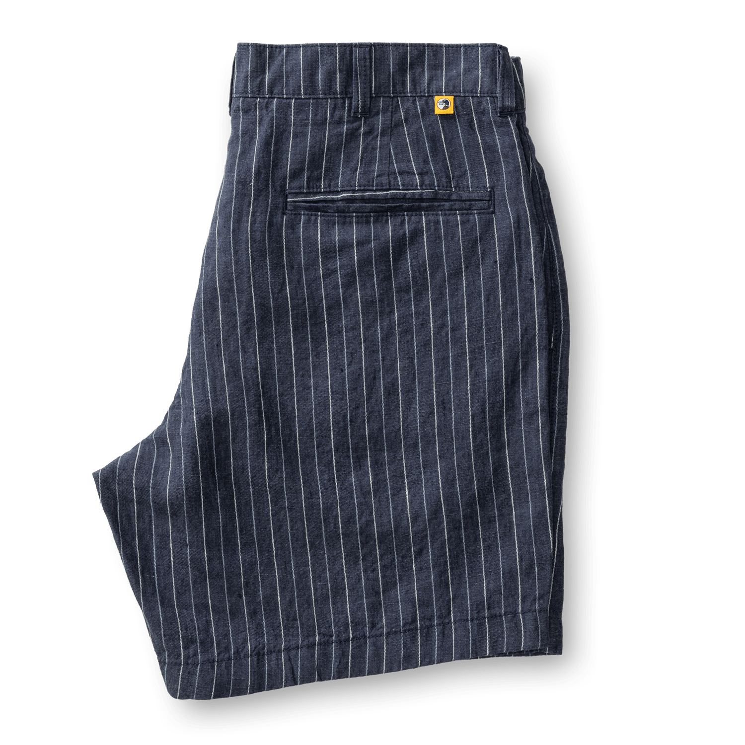 Duck Head Gold School Linen Chino Shorts in navy blue pinstripe feature a back pocket, antique brass button, YKK metal zipper, and a yellow tag above the pocket, shown on a white background.