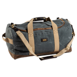 The Duck Head Waxed Canvas Weekender Bag features green waxed canvas, tan straps, a large zipper, small front pocket, and leather accents on handles and corners. Made in the USA and carry-on compliant for convenient travel.