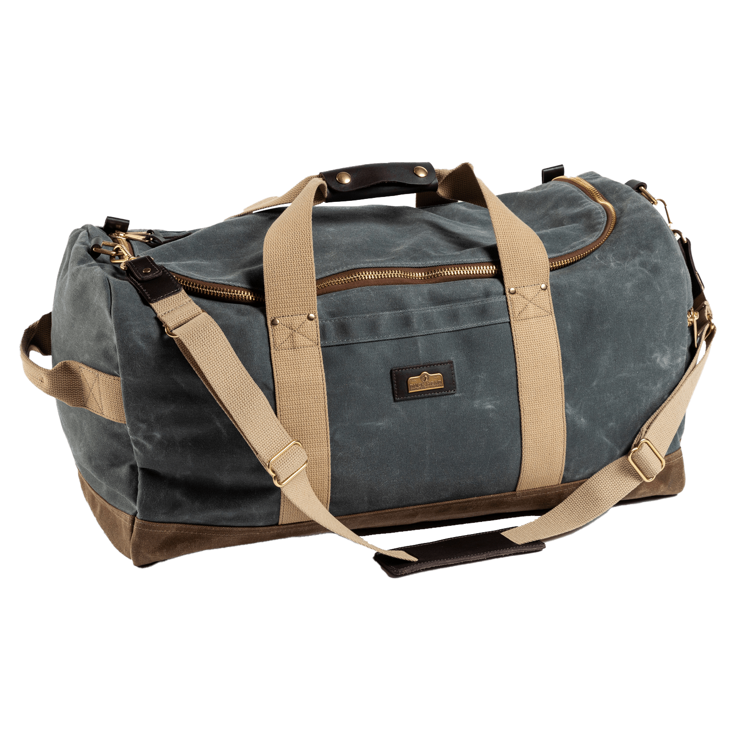 The Duck Head Waxed Canvas Weekender Bag features green waxed canvas, tan straps, a large zipper, small front pocket, and leather accents on handles and corners. Made in the USA and carry-on compliant for convenient travel.