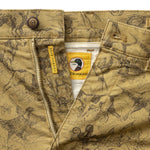 Classic Fit Gold School Chino Wheatfield Print tan chinos with a dark brown botanical print, a metal zipper, waist button, and interior tags with a “Gold School” mallard duck logo.