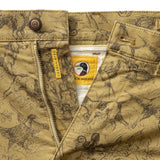Classic Fit Gold School Chino Wheatfield Print tan chinos with a dark brown botanical print, a metal zipper, waist button, and interior tags with a “Gold School” mallard duck logo.