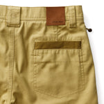Duck Head Field Canvas Briar Pant in tan, featuring a back pocket with a contrasting patch and a leather-look brand label on the waistband.