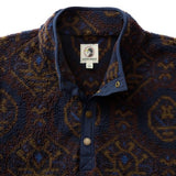 Pineview Fleece 1/4 Snap Pullover by Duck Head in a blue, brown, and orange patterned print with a navy blue placket.