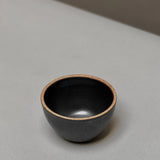 Large Stoneware Smudge Bowl by Incausa, handmade in dark gray with a light-colored rim.