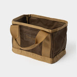 The Duck Camp Canvas Ammo Tote by Duck Camp is a rectangular brown and tan canvas bag featuring two sturdy handles and reinforced seams, shown against a plain white background.