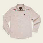 Howler Brothers Crosscut Deluxe long-sleeve western shirt in beige, featuring snap buttons, front pockets, and colorful bird embroidery on the shoulders inspired by Parrot Patrol, displayed on a plain background.