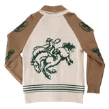 Back view of the Nuevo Laredo Cardigan, a cotton acrylic shawl collar style featuring a green intarsia bucking horse and rider on the back and decorative motifs on the sleeves.