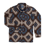 Santa Fe Jacket by Sendero Provisions Co., a Western-style button-down jacket featuring a brown and blue geometric southwest print, a chest pocket, and two lower pockets.