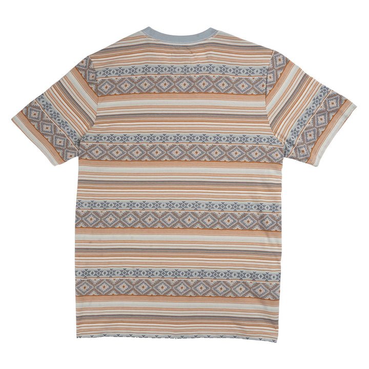 Back view of the Bisbee Jacquard Tee by Sendero Provisions Co.—a short-sleeve T-shirt featuring horizontal stripes and geometric Aztec-style patterns in tan, brown, blue, and grey tones, crafted from soft cotton jacquard for a Southwest-inspired look.