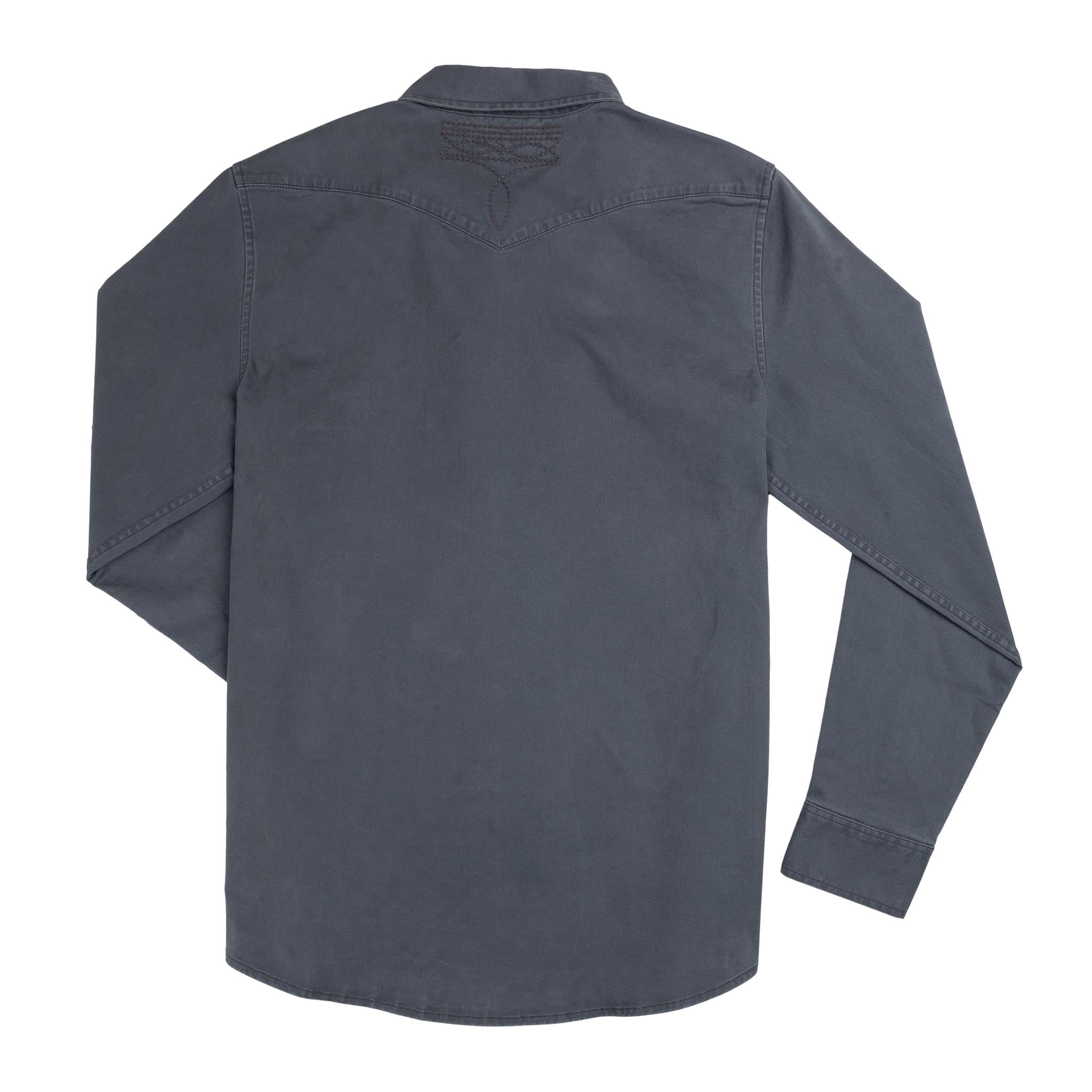A long-sleeve Stamford Work Shirt in Concho Blue by Sendero Provisions Co. is laid flat, shown from the back with visible seams and a small stitched detail near the collar.