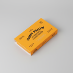 A closed rectangular orange box of “Fluffy Pillow Incense Sticks | Collins” by Collins, labeled with “Everyday Good Mood,” contains 70 sugar-colored sticks. Made with natural ingredients, the box rests on a light gray surface.