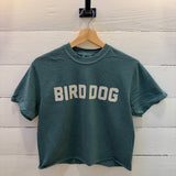 Emerald Bird Dog Honor Crop Ballad of the Bird Dog T-shirt with the text “BIRD DOG” printed in white across the chest.
