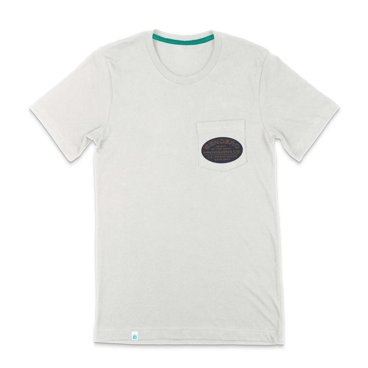 The Jackalope Pocket Tee by Sendero Provisions Co. is a light gray organic cotton short-sleeve shirt with a chest pocket featuring a dark oval Jackalope logo and text, and has a green inner accent on the collar.