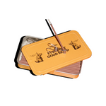 A yellow metal case labeled “EVERY GOOD MOOD” holds Fluffy Pillow Incense Sticks by Collins, made from natural ingredients with a sandalwood scent; one stick is placed on top, and incense holder plus tweezer accessories are included inside.