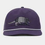 The Armadillo Hat by Duck Camp is a purple 5-panel cap with a stylish grey rope detail above the brim, featuring an embroidered armadillo on the front and an adjustable snapback for a comfortable fit.