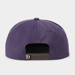 Back view of the Duck Camp Armadillo Hat in purple, featuring an adjustable black snapback closure, displayed against a plain light background.
