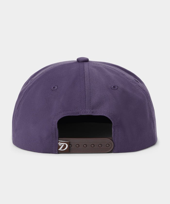 Back view of the Duck Camp Armadillo Hat in purple, featuring an adjustable black snapback closure, displayed against a plain light background.