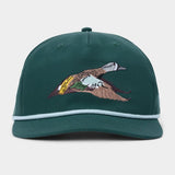 Introducing the Duck Camp Blue Winged Teal Hat by Duck Camp—a green adjustable snapback cap accented with crisp white trim and an embroidered flying blue-winged teal duck on the front panel. Built with a durable polyester shell, this classic hat ensures both comfort and long-lasting wear.
