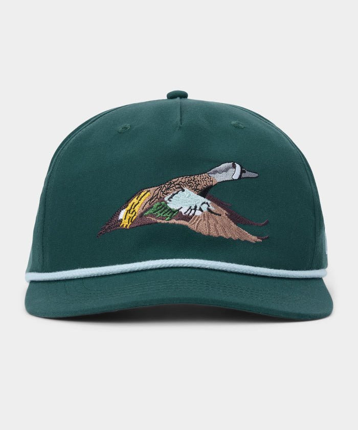 Introducing the Duck Camp Blue Winged Teal Hat by Duck Camp—a green adjustable snapback cap accented with crisp white trim and an embroidered flying blue-winged teal duck on the front panel. Built with a durable polyester shell, this classic hat ensures both comfort and long-lasting wear.