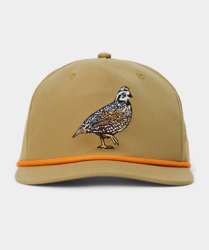 The Duck Camp Bobwhite Quail Hat by Duck Camp features a tan polyester shell, an embroidered quail on the front, and a vibrant orange trim along the brim. This hat offers a comfortable fit with its adjustable snapback closure and is shown against a plain background.