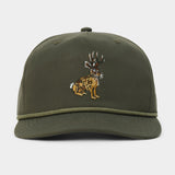 The Duck Camp Jackalope Hat is an olive green baseball cap featuring an embroidered jackalope design on the front, a decorative cord above the brim, and an adjustable snapback for a comfortable fit.