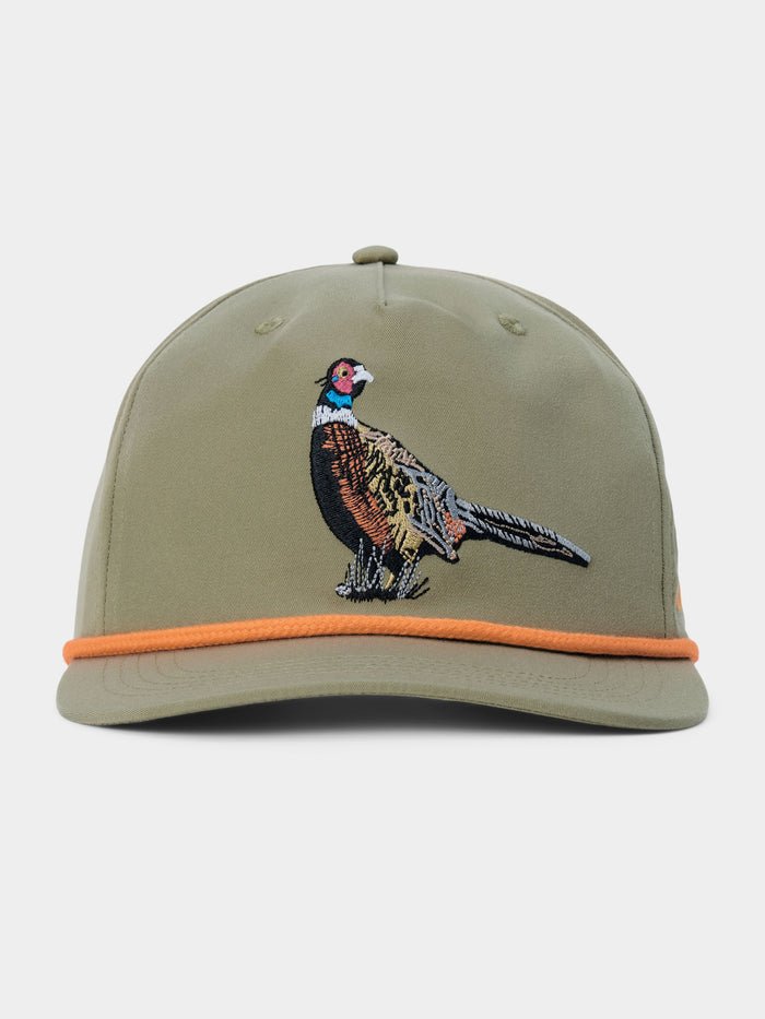 The Duck Camp Pheasant Hat by Duck Camp is an olive green baseball cap featuring an embroidered pheasant on the front, an orange band above the brim, and an adjustable snapback closure for a comfortable fit.