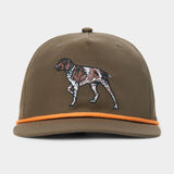 Introducing the Duck Camp Pointer Hat by Duck Camp: an olive green baseball cap featuring an embroidered dog on the front and a distinctive orange cord above the brim. Designed with a comfortable polyester shell and a classic snapback closure for easy adjustment.
