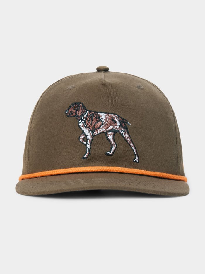 Introducing the Duck Camp Pointer Hat by Duck Camp: an olive green baseball cap featuring an embroidered dog on the front and a distinctive orange cord above the brim. Designed with a comfortable polyester shell and a classic snapback closure for easy adjustment.