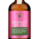 A brown glass bottle with a pink label reading "Prickly Pear Syrup | Yes Cocktail Co" contains a vibrant syrup made from real prickly pear juice, perfect for cocktails, crafted by Yes Cocktail Co.