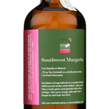 A brown glass bottle of Yes Cocktail Co. Prickly Pear Syrup features a green label with a Southwest Margarita recipe, prickly pear juice highlights, and a pink sticker on the side.