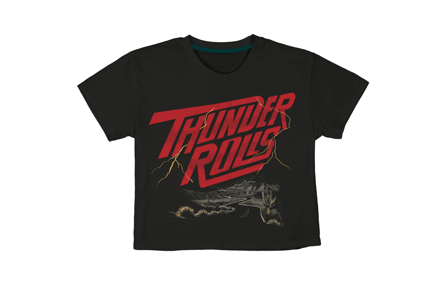 The Thunder Rolls Crop Tee by Sendero Provisions Co. is a black t-shirt crafted from ultra-soft organic cotton, featuring “Thunder Rolls” in bold red lettering, yellow lightning bolts, and a sketched road with sparse vegetation along the bottom. Tailored sleeves provide a structured, modern fit.