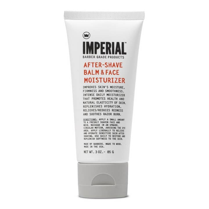 A white tube labeled "After-Shave Balm & Face Moisturizer | Imperial Barber Products" with product details and usage instructions on the front, formulated with natural ingredients for soothing post-shave care.
