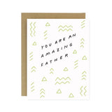 The Amazing Father's Day Card by Worthwhile Paper features "You are an amazing father" in black text with light green geometric patterns and includes a brown recycled paper envelope.