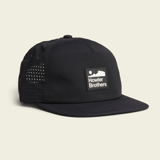 The Howler Brothers Aperture Tech Strapback is a breathable baseball cap featuring mesh side panels and a rectangular front logo patch, making it perfect for outdoor adventures and all-day comfort.