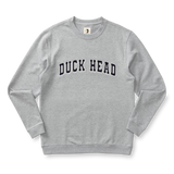 The Duck Head Applique Crewneck Sweatshirt is a vintage-inspired cotton sweatshirt in light gray, featuring large black "DUCK HEAD" appliqué lettering across the chest.