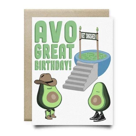 Anvil Cards Avo Great Birthday by Anvil Cards is an A2 size card featuring two cartoon avocados—one sporting a cowboy hat and the other in sneakers—standing before a guacamole bowl with a playful “Get Smashed!” sign. Lovingly handmade in Houston and printed on textured linen paper, this cheerful card reads “AVO GREAT BIRTHDAY!”.